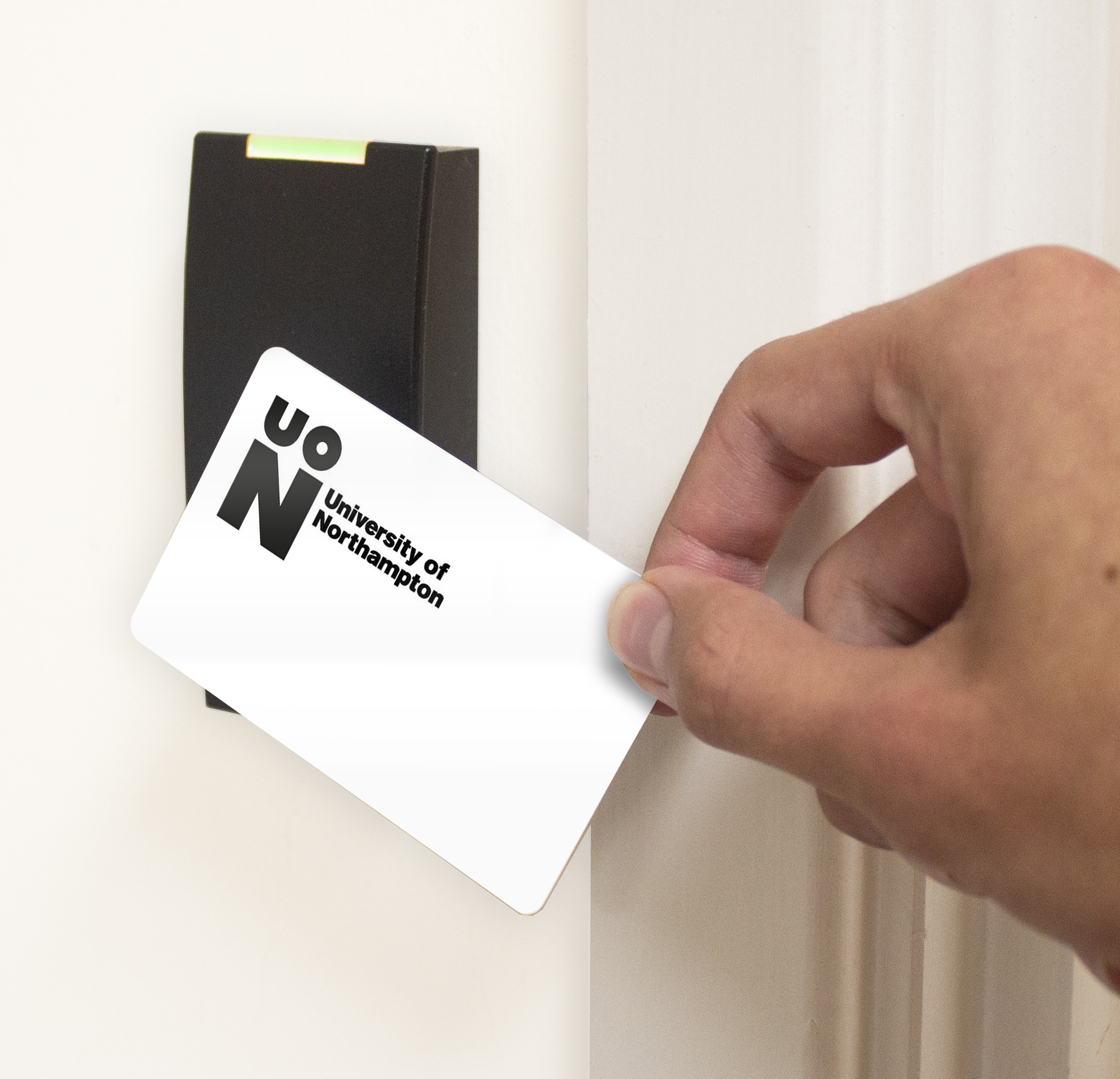 Access control card being used to grant entry to a building